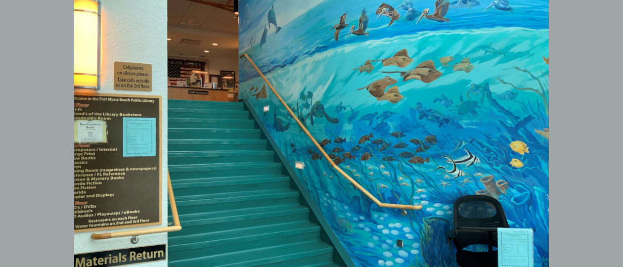 Interior building picture ground floor foyer  entrance looking up at circulation area featuring wall mural